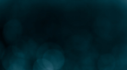Bokeh Background  Very dark (mostly black) cyan.