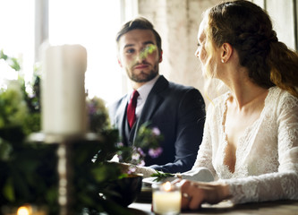 Bride and Groom Having Meal with Friends at Wedding Reception