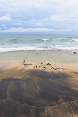 Black sand on beach