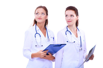 Fototapeta premium Two woman nurse watching X Ray image, standing in hospital