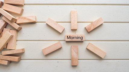 Naklejka na ściany i meble morning word written on wood block top view