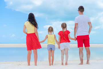 Young family on vacation on the beach