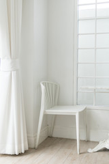 Fototapeta na wymiar white chair decoration,single chair on white color tone,alone and nobody concept