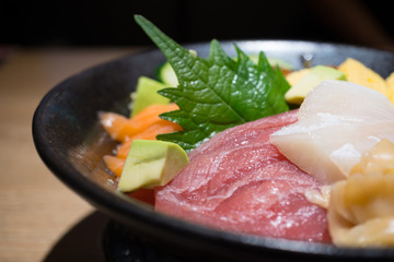 Fresh sashimi set in black bowl