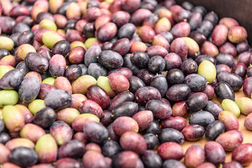 Pile of raw black and green olives