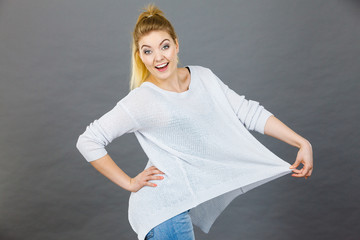 Woman wearing too big jumper