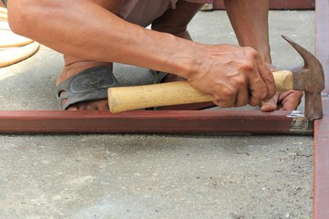 The hands of the smith and hammer