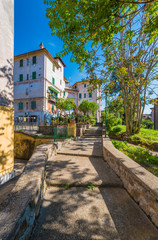Rome, Italy - The suggestive popular Garbatella quarter in Ostiense district, an agglomeration in Rococo style with gardens and the famous modern bridge named Settimia Spizzichino