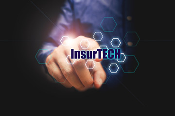 Insurance technology (Insurtech) concept, businessman pressing text with virtual screen.