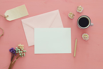 vintage mockup with flowers, cup of coffee and blank letter