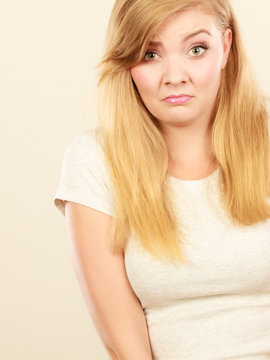 Sad cute young blonde attractive woman