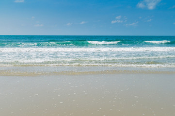 Tropical beach with clear water and blue sky