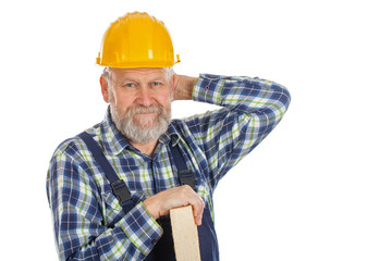 Tired male engineer holding a lath - isolated background