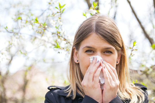 Allergic Woman Sneezing Outdoor On Springtime