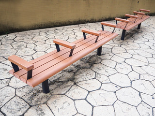 Wooden bench beside the street nearby the bus stop in Kyoto, Japan