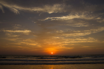 Naklejka na ściany i meble Amazing sunset at Arambol beach, North Goa, India