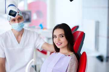 Portrait of a dentist and a beautiful girl in dentistry.