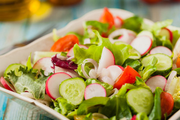 Fresh salad with radish, cucumber, colorful cherry tomatoes. Best for bbq.