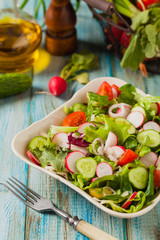Fresh salad with radish, cucumber, colorful cherry tomatoes. Best for bbq.