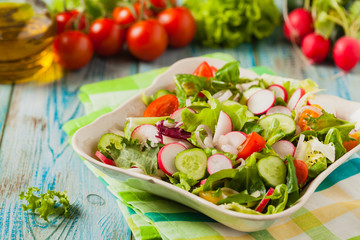 Fresh salad with radish, cucumber, colorful cherry tomatoes. Best for bbq.