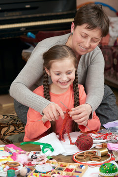 mother and child girl knit, handmade and handicraft concept
