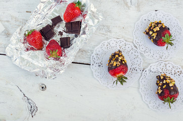 Obraz na płótnie Canvas Strawberries covered with a chocolate