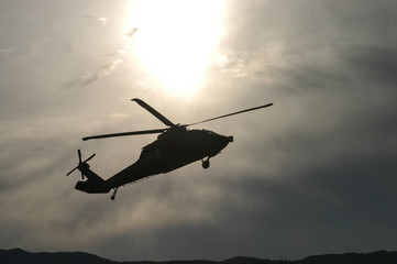 Fototapeta na wymiar Military helicopter silhouette