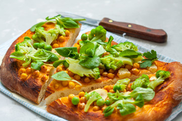 Vegan pizza with chickpeas and broccoli. Love for a healthy vegan food concept