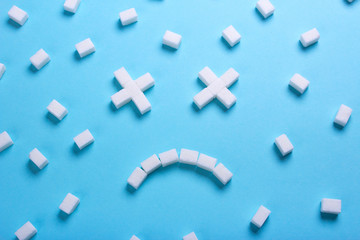 Smiley dead from cubes of sugar. Sugar kills