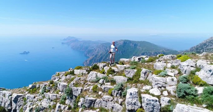 joung woman hiking in mountains above Amalfi coast
