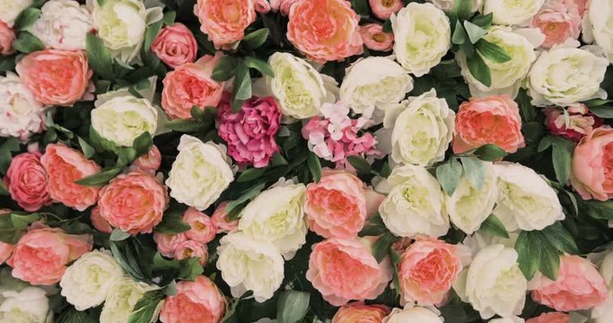 A lot of roses and Peonies stand in pots buckets, a Large Bouquet of Roses and Peonies, beautiful flower field yellow green white pink purple and red