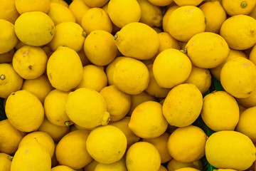 Colorful display of lemons in market