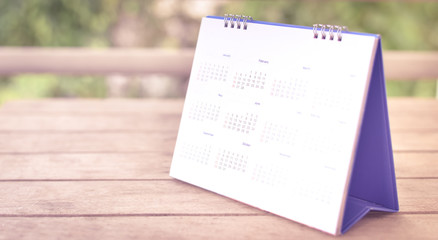 Blurred calendar on white texture.