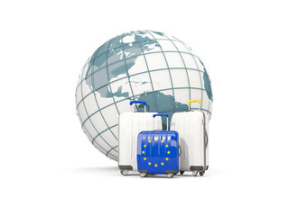 Luggage with flag of european union. Three bags in front of globe