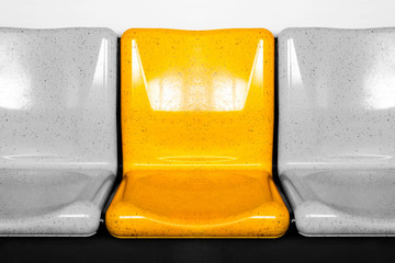 empty interior of electric train cabin, yellow seats in electric train, seats in electric trains....