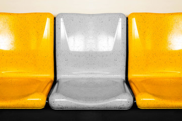 empty interior of electric train cabin, yellow seats in electric train, seats in electric trains. Bangkok skytrain.