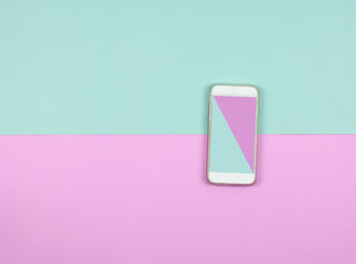 blue and pink color on smart phone screen on colored background. Minimalconcept. Flat lay.top view.