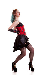 Gorgeous BDSM model in leather corset isolated on white background in studio photo