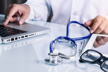 tools of doctor on desk.