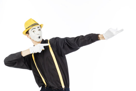 Portrait of a man, artist,clown,MIME.Shows up on something. Isolated on white background