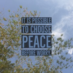 Inspirational motivational quote "It is possible to choose peace before worry" on bamboo leaf and sky background.