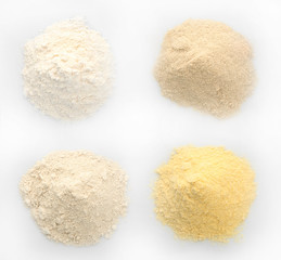 Different kinds of flour on white background