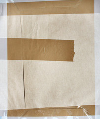 Background with paper texture and stick tape of brown color