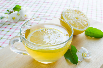 Mug of tea with lemon early in the morning