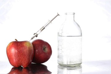 Genetically modified foods, apple pumped with chemicals