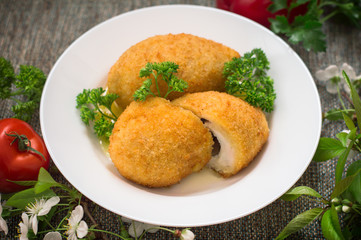 Chicken cutlets on Kiev. Old background. Top view. Close-up