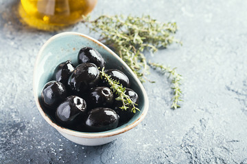 Bowl filled with fresh black olives