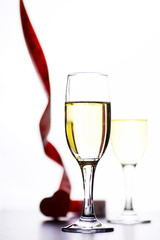 glass of white wine on a table on white background isolate