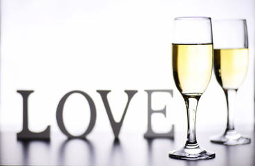 glass of white wine on a table on white background isolate