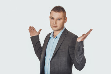 Businessman making undecided gesture